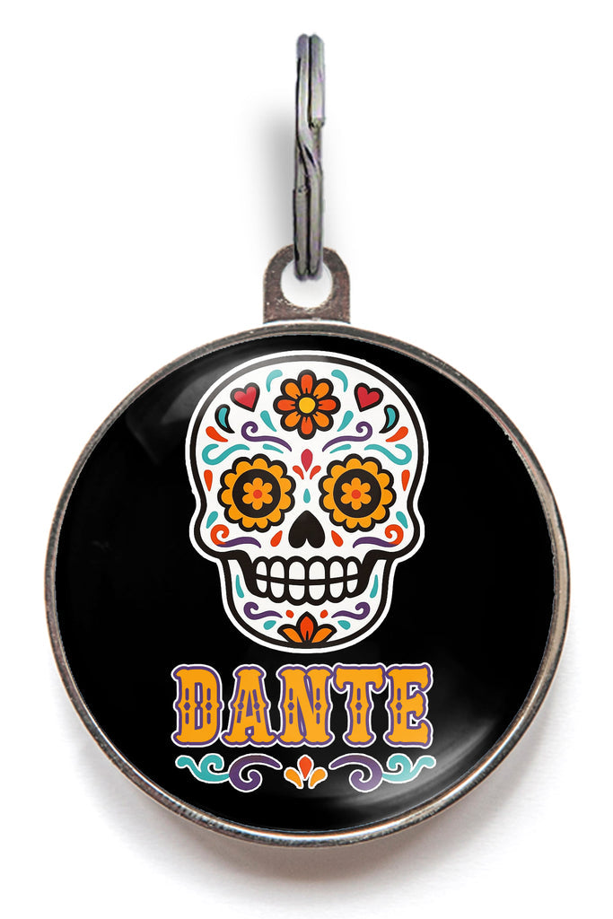 Day of the Dead dog tag featuring colourful sugar skull with pet name “Dante” – personalised Halloween pet ID tag for dogs and cats