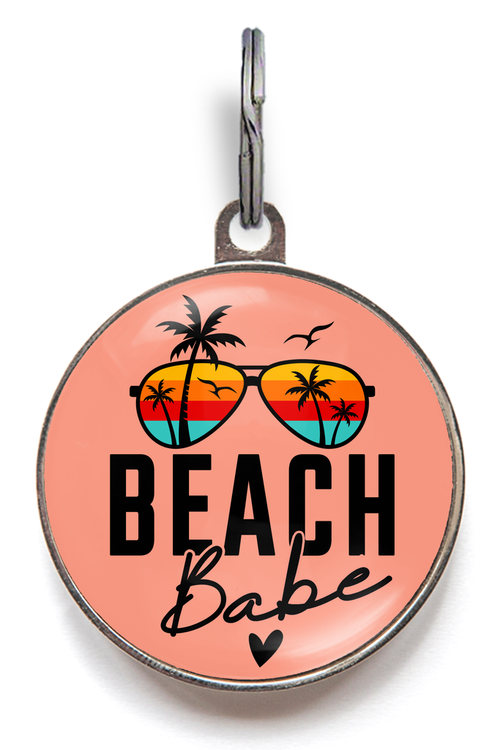 Beach Babe Pet Tag - Black text saying "beach babe" on a coral background with sunglasses and palm trees