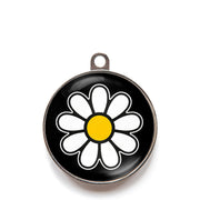 Black daisy dog ID tag with white flower icon