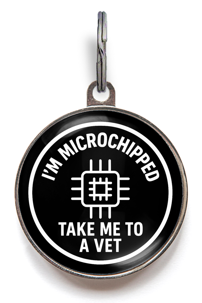 Pet tag with 'I'm microchipped, take me to a vet' text on a white background