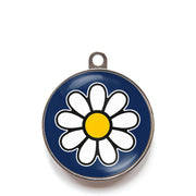 Blue daisy dog ID tag with white flower icon