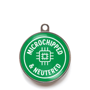 Green microchipped and neutered dog ID tag with white chip icon