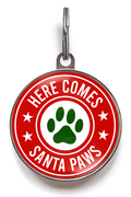 Here Comes Santa Paws Pet Tag on a red and white tag, featuring a festive green paw print