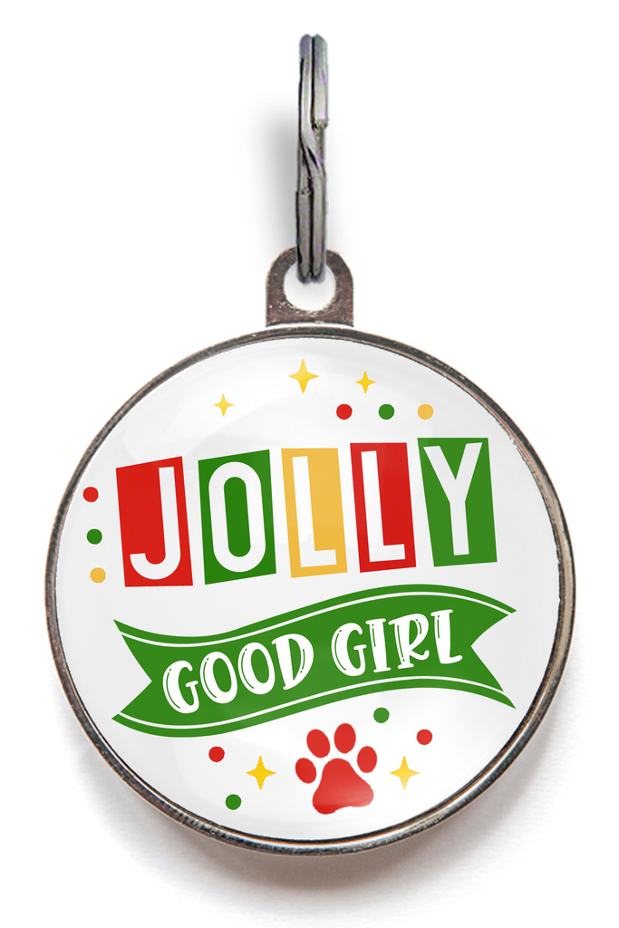 Christmas dog tag reading “Jolly Good Girl” in red, green and gold