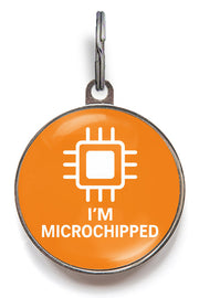 Orange pet tag with 'I'm Microchipped' text and chip icon on a white background