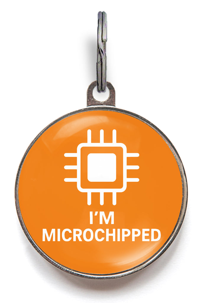 Orange pet tag with 'I'm Microchipped' text and chip icon on a white background