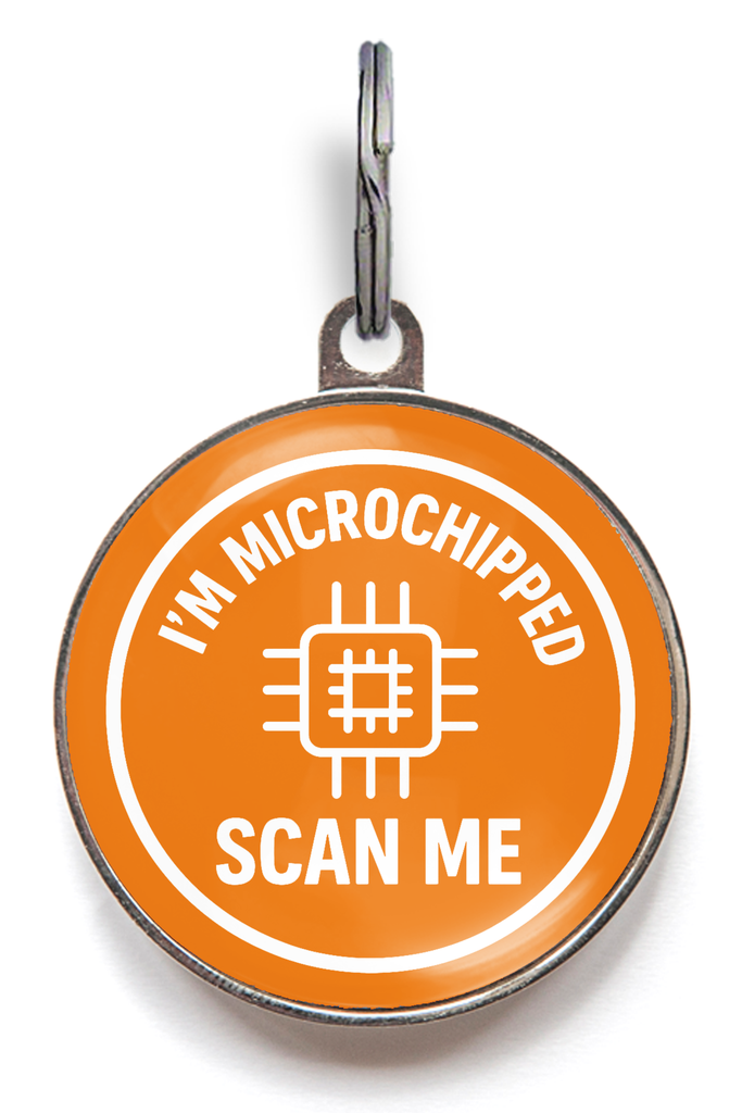 Orange pet tag with 'I'm Microchipped Scan Me' text on a white background