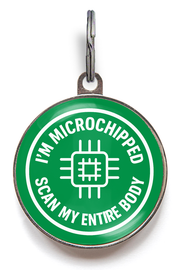 Green pet tag with text 'I'm microchipped, scan my entire body' on a white background