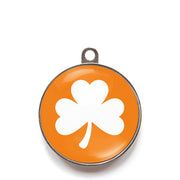 Orange classic clover dog ID tag with white shamrock icon