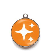 Orange sparkle dog ID tag with white sparkle icons