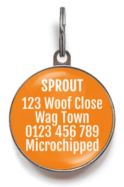 Back of orange I'm Microchipped - Scan Me pet tag