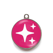 Pink sparkle dog ID tag with white sparkle icons