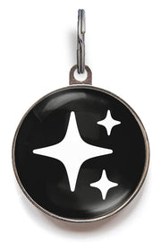 Black sparkle dog ID tag with white star sparkle icons and glossy resin finish
