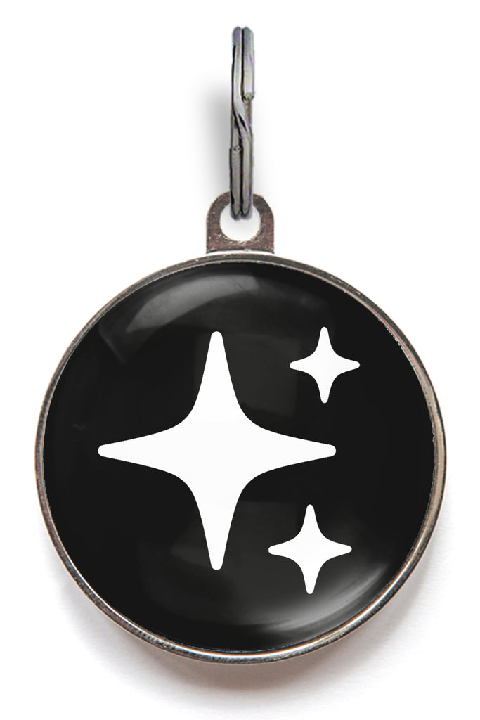 Black sparkle dog ID tag with white star sparkle icons and glossy resin finish