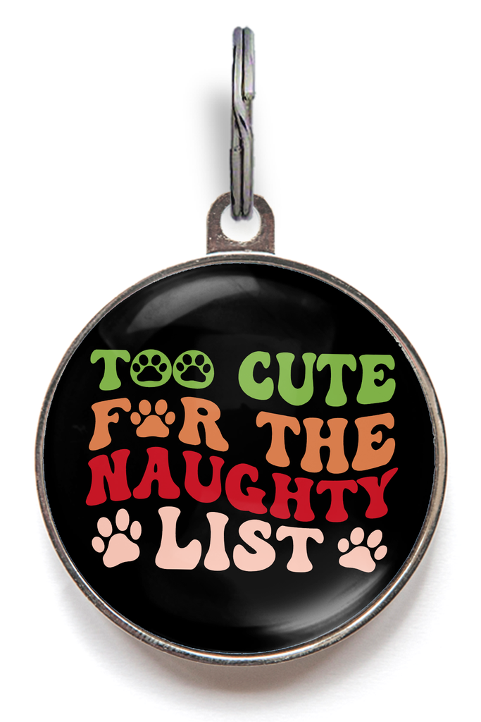 Too Cute For The Naughty List Pet ID Tag. Too cute for the naughty list written in a colourful retro font on a black background featuring paw prints