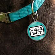 Close-up wiggle butt dog tag personalised aqua dog ID tag with bold funny lettering