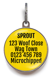 Yellow pet tag with black text on a white background